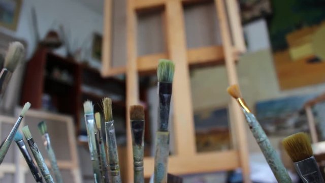 Artist's canvas in artistic studio. Oil paintings in creative workroom