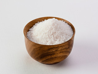 Fototapeta na wymiar salt in wooden bowl isolated white background