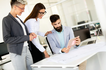 Picture of young architects discussing in office