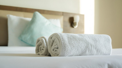 White towel shampoo and soap on a bed. - 192285659