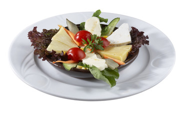 Mixed cheese dinner platter from different varieties of cheese decorated with tomato  lettuce parsley isolated on white, horizontal picture
