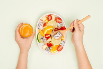 Top view of a man enjoying delicious summer fruits