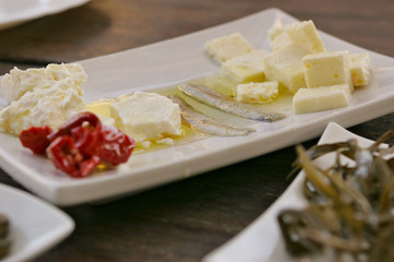Salted anchovies with salty cheese, restaurant, food, Greece.