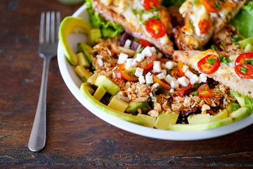 Salad chevre chaud with fork. French kitchen. Close-up. Top view with copy space