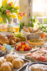 Table with delicatessen ready for Easter brunch
