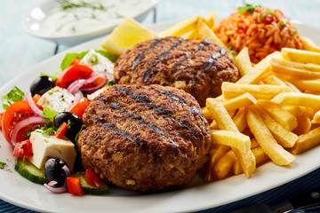 Traditional bifteki with Greek salad and chips