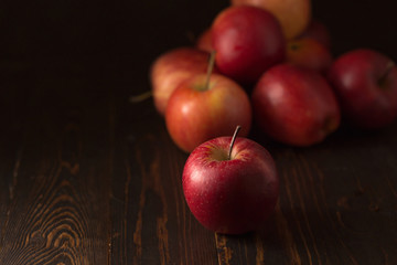 Red apples fruit on a dark background