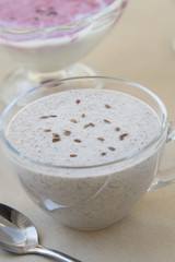 Glass of classik greek yoghurt with crushed flax seeds