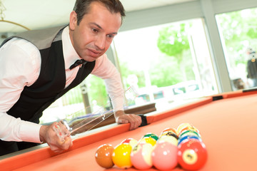 man preparing billiard balls