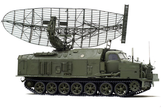 obsolete self-propelled radar station on a caterpillar track, slightly sprinkled with snow, on a white background