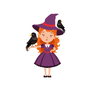 Little red-haired girl witch standing with one black bird on the hat and another on the hand. Kid character in purple dress, Halloween costume. Flat cartoon vector on white.