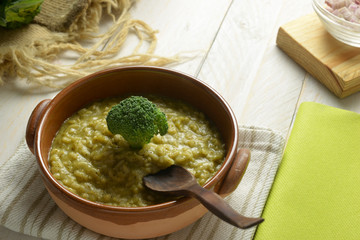 risotto with broccoli, on wooden table
