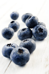 blueberries on white wood