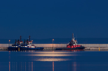 FIREBOAT AND TUGS - Auxiliary ships sleep at the quay on a moonlit night © Wojciech Wrzesień