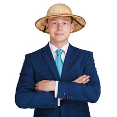 businessman with suit and crossed arms with travel hat smiling.