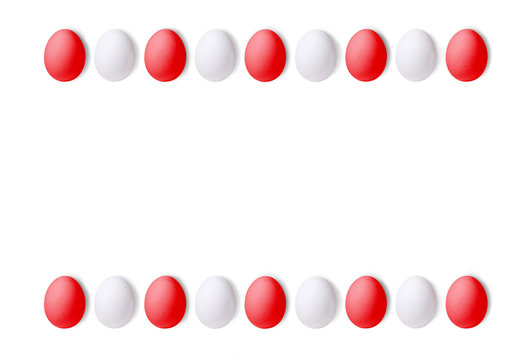 Set of red and white eggs on a white background, laid in a line. Texture with space for text. isolated