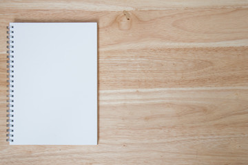 note book on wood table