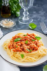 Spaghetti with meat ragout, tomato sauce and cheese, selective focus