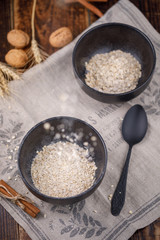 Easy and healthy breakfast. Leavening in a bowl of dry cereal oatmeal.