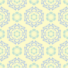 Fototapeta na wymiar Floral seamless pattern. Beige background with light blue and green flower elements