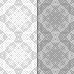 Gray and white geometric ornaments. Set of seamless patterns