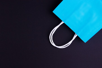 blue shopping bag on white-black background