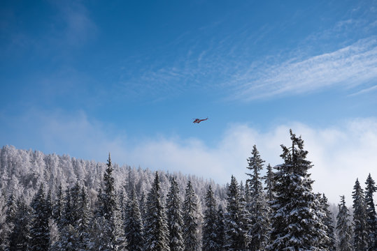 HIGH TATRAS, SLOVAKIA - FEBRUARY 11, 2018: Search and rescue helicopter flying around High Tatras