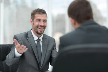 closeup of two businessmen discussing new project