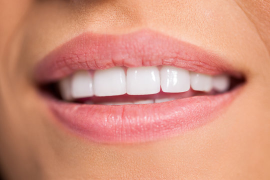 Smiling female mouth with white teeth