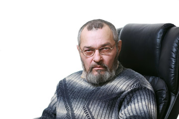 Fototapeta premium A man with a beard in a chair