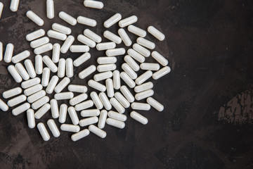 White madicine capsules contain vitamin, drug or nutritional supplement