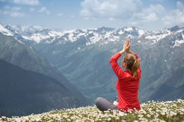  young woman practicing yoga on a mountain top © andreusK