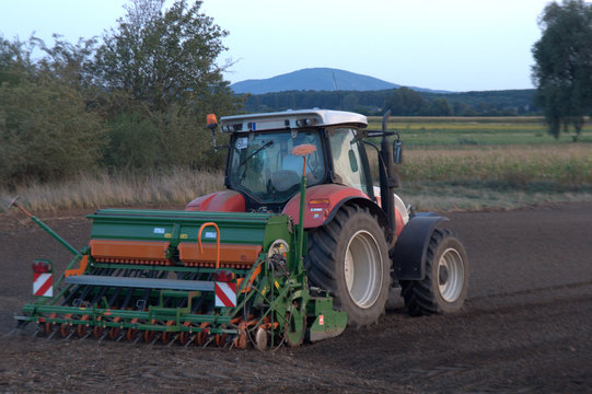 Tractor working at field/ tractor preparing field for cultivation