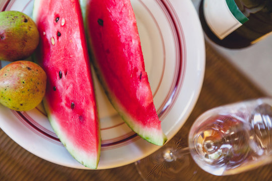 Slices of watermelon and pears lie on plate