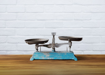 old vintage weight scale on wooden table, justice symbol