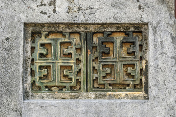 decorative ornaments inside the complex of the mausoleum of the emperor Minh Mang in Hue, Vietnam.
