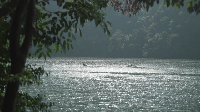 Paddle boat in shimmering water on dayang bunting island, Langkawi, Malaysia.