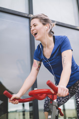 Woman practicing spinning at the gym