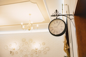 Decorative round street clock in the room