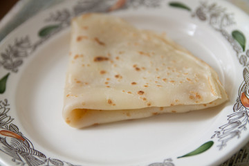 a fresh baked pancake on a plate