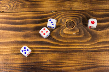 White dice on wooden table. Game of chance concept