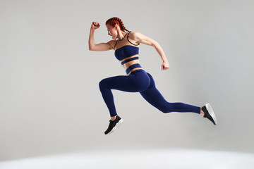 Fototapeta na wymiar woman in blue sportswear running