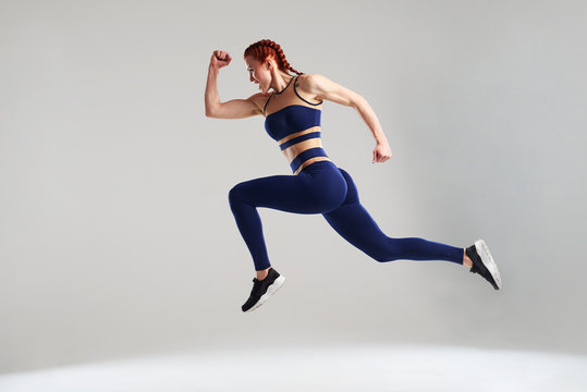woman in blue sportswear running