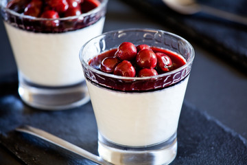 Glasses Of Homemade Panna Cotta With Cherries