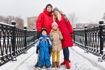 Image of family with children in winter on walk