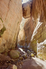 Avakas Gorge in Cyprus. Little river in foreground, sunlit rocks