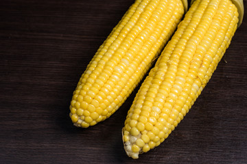 Corn on wood background.