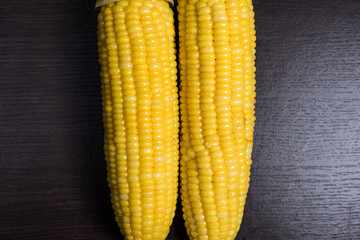 Corn on wood background.