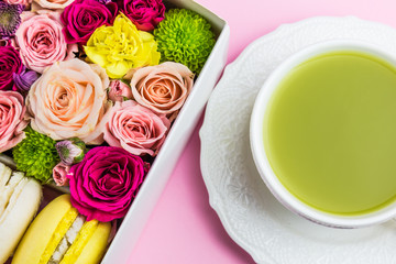 Set of flowers,sweet macaroons and green tea match. Gift. Surprise for the girl