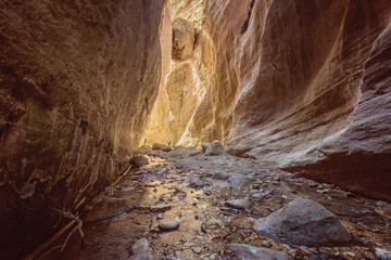 Avakas Gorge in Cyprus. Little river in foreground, sunlit rocks
